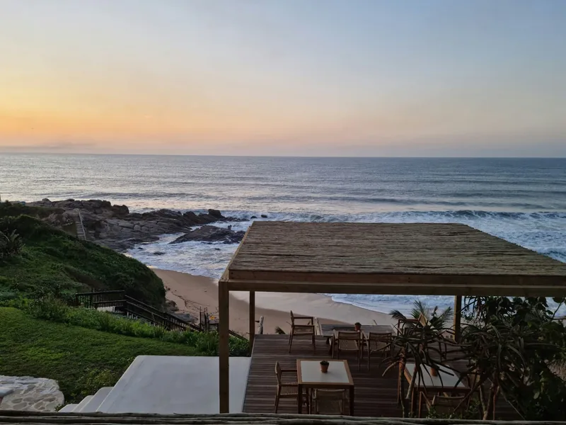 Open-air deck above the ocean at dusk